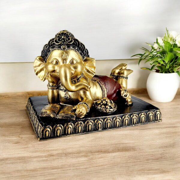 Karigaari India Reading Baby Ganesha Idol ? Gold Finish Resin Ganpati Statue with Book ? Decorative Showpiece for Home Temple, Office Desk, Car Dashboard & Gift Purpose